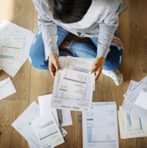 woman-looking-at-bills-debt-consolidation-help